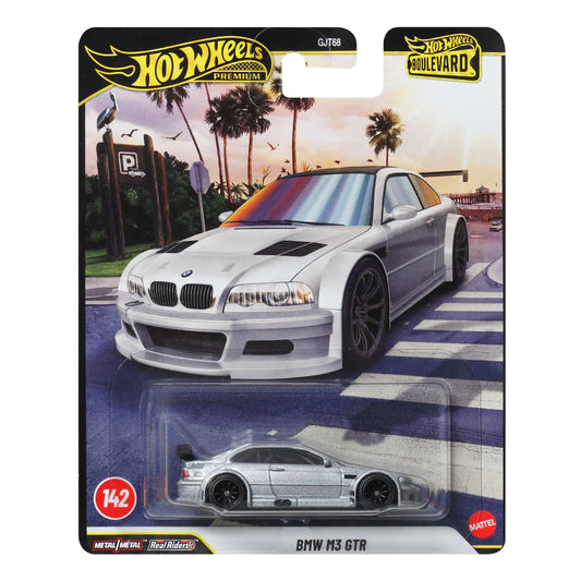 Hot Wheels BMW M3 GTR toy car in packaging with palm tree and sunset background